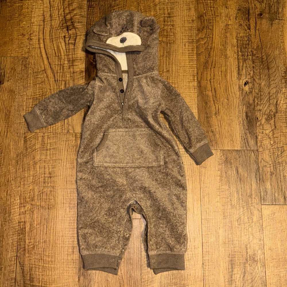 Fleece hooded onsie with bear face and ears.  Excellent condition!